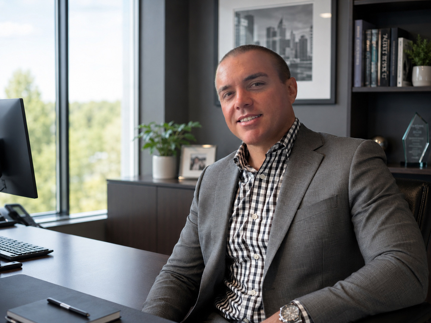Bill Spencer Mercer III, founder of Shelterfy, seated at his desk.